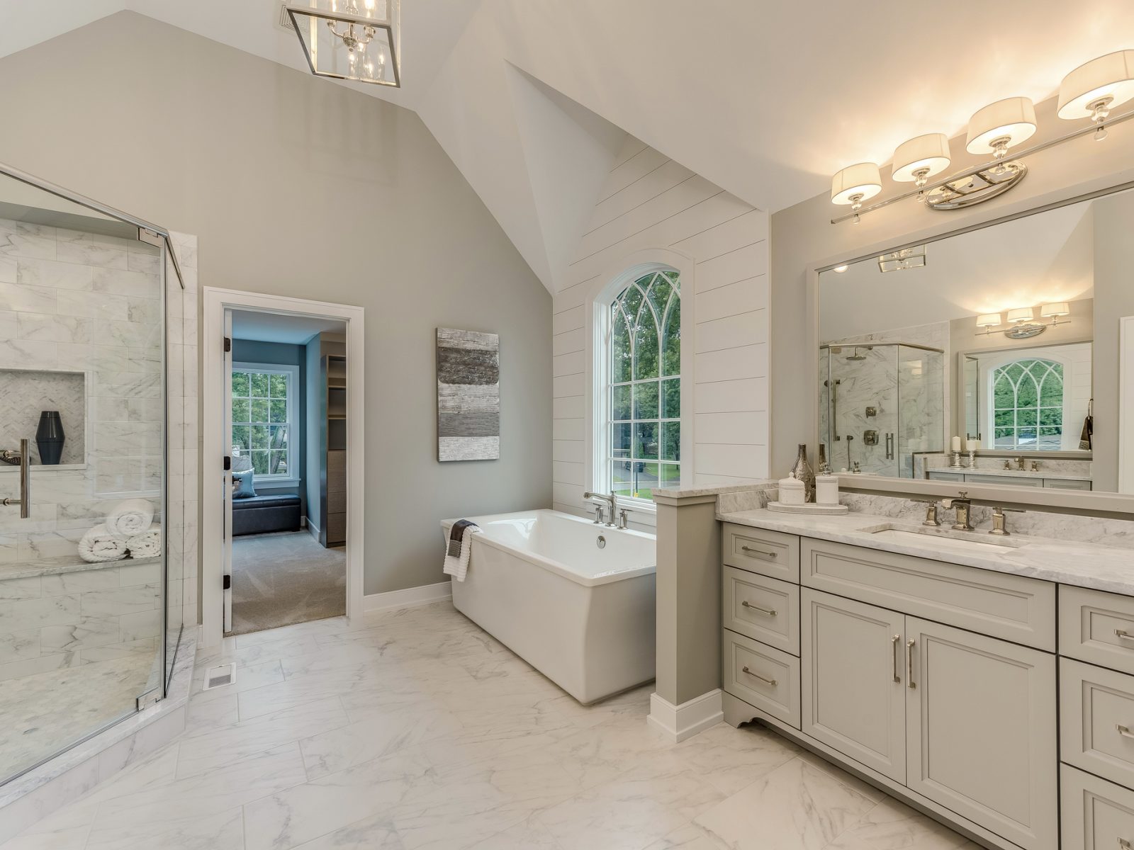 Soaking tub near a decorative window